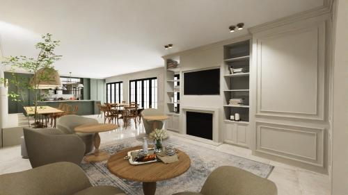 a living room with a table and chairs and a fireplace at Hôtel Maison Turenne in Martel