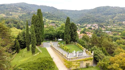 an aerial view of a park with trees and a building at Villa Lucini 1886 Garden Apt near Lake Como and Milan in Rovagnate