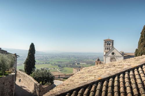 a view of a church from the roof of a building at Le Dimore della Custodia in Assisi