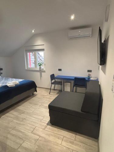 Ένα ή περισσότερα κρεβάτια σε δωμάτιο στο Rooms Jelak