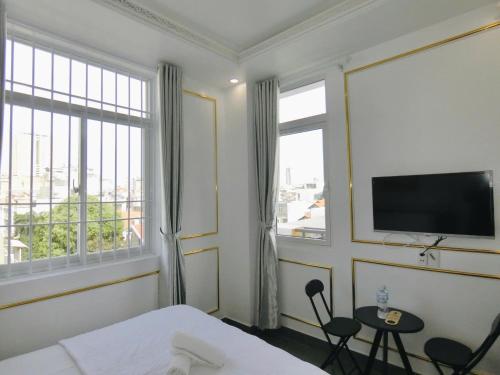 TV a/nebo společenská místnost v ubytování Ngọc Châu Hotel