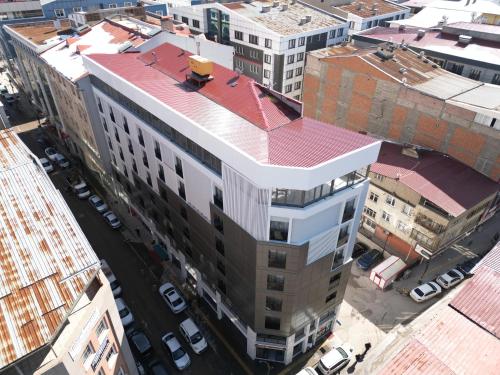 an overhead view of a tall building with a red roof at Mir Emir Hotel in Bostaniçi