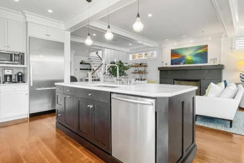 a kitchen with a large island in the middle at Waterside Haven in Branford