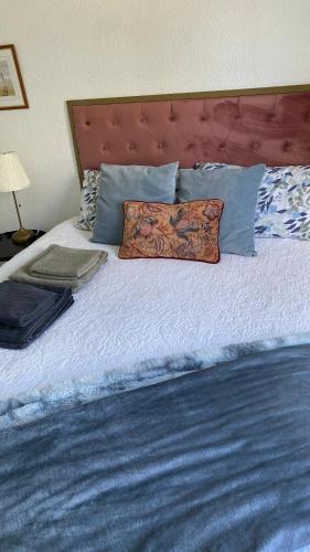 a bed with two pillows on top of it at Sunylife in Albir