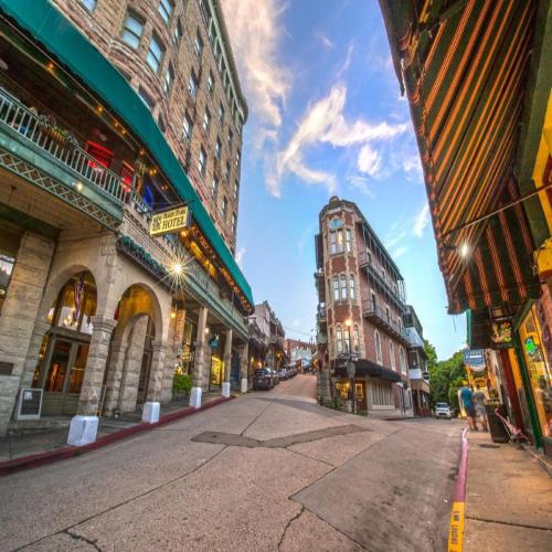 an empty street in a city with tall buildings at Bella Paradiso 5 King Bed Studio Walk to Downtown in Eureka Springs