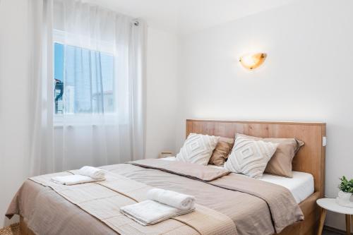 Ένα ή περισσότερα κρεβάτια σε δωμάτιο στο Apartments Quercus