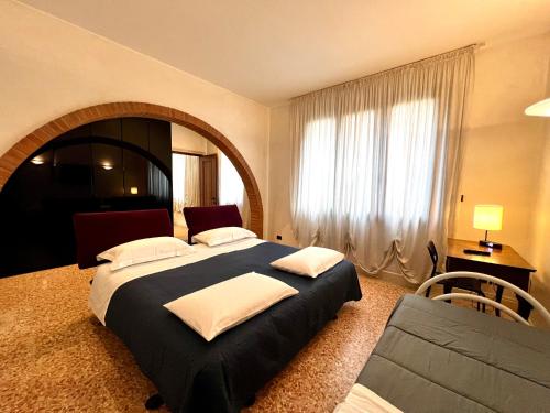Postel nebo postele na pokoji v ubytování Locazione Turistica Joyful Padova
