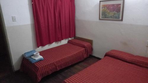 Postel nebo postele na pokoji v ubytování Hotel Florentino