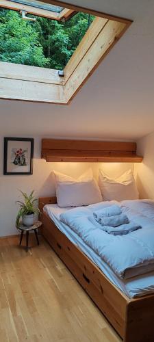a bedroom with a large bed in a attic at Ferienwohnung Spitzingsattel in Schliersee