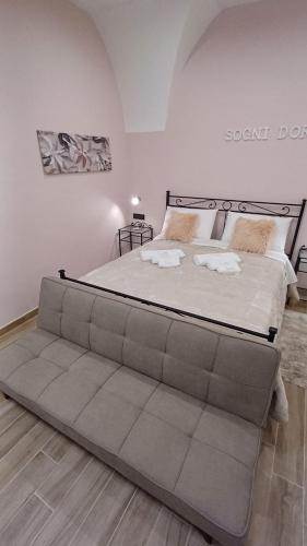 a large bed in a room with a large bed frame at Sogni D'oro 01 in Partinico
