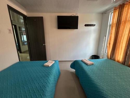 TV a/nebo společenská místnost v ubytování Hotel Casa Blanca Mirador