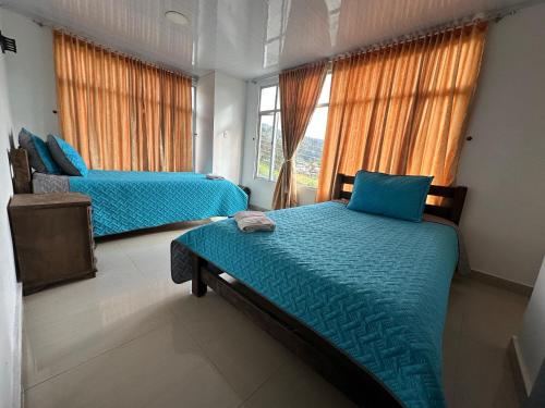 Postel nebo postele na pokoji v ubytování Hotel Casa Blanca Mirador