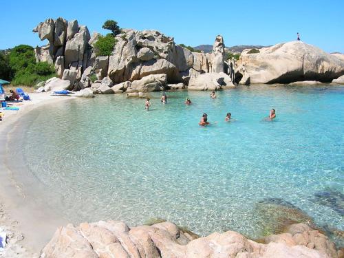 a group of people in the water at a beach at Casa Marina Maria in Murta Maria