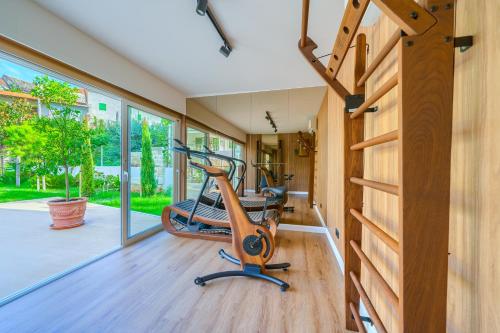 a gym with a exercise bike in a room at Hotel Brattia, Adults Only, Heated Pool, A la Carte Breakfast, Postira, Brač Island in Postira