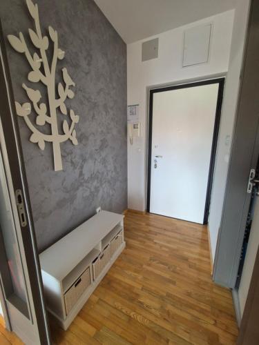 a hallway with a bench in front of a door at Moni in Osijek