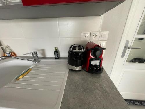 a kitchen counter with a sink and a toaster at Modern and Bright home walk to beach with garage in Berck-sur-Mer