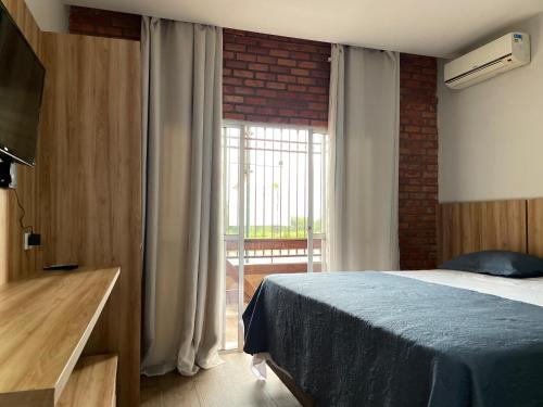 Ένα ή περισσότερα κρεβάτια σε δωμάτιο στο Hotel Villa Green