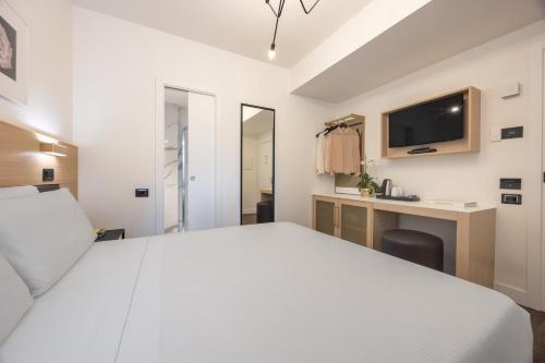 Postel nebo postele na pokoji v ubytování Globus Urban Hotel