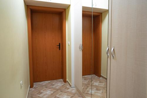 a hallway with a shower and a glass door at Claire Apartment with Garden in Sofia