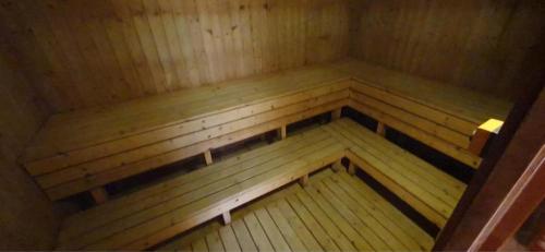 an inside view of a sauna with a wooden floor at Apartment Sunset in Zalakaros