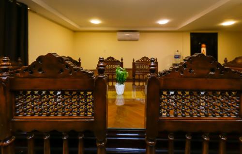 a row of chairs in a room with a potted plant at Turquoise Pyramids palace in Giza