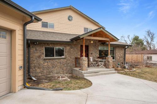 a home being remodeled with a stone wall at 180 S Hoyt in Lakewood