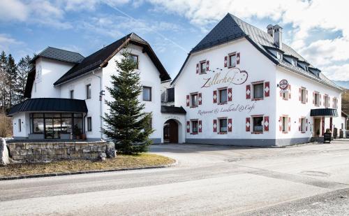 a large white building on the side of a street at Landhotel Zellerhof in Lunz am See
