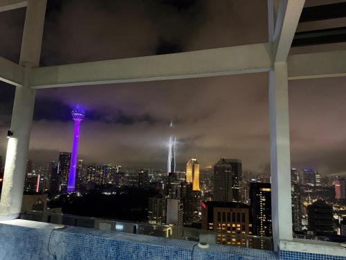 a view of the sydney city skyline at night at The Luxe Colony Klcc By NTR Resources in Kuala Lumpur