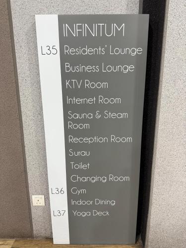 a sign in a room with a bunch of names at The Luxe Colony KLCC By AZHA in Kuala Lumpur