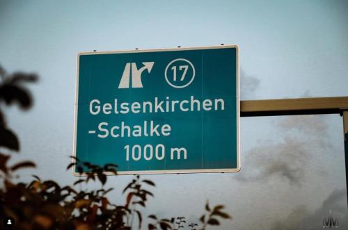 a green street sign on the side of a road at Domblick 2 I Balkon I Parkplatz I Nähe Veltins-Arena in Gelsenkirchen