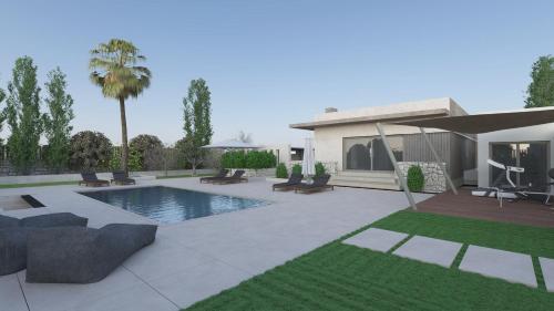 a patio with a pool and chairs and a house at Green Acre Villa in Karteros