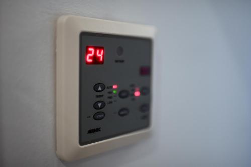 a close up of a remote control on a wall at Cantina Langelina in Corinaldo