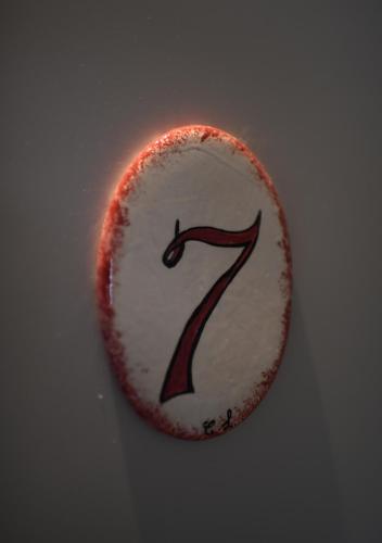 a white frisbee with the number seven on it at Cantina Langelina in Corinaldo