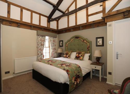 a bedroom with two beds in a room at The Castle Of Brecon Hotel, Brecon, Powys - The Coaching Inn Group in Brecon