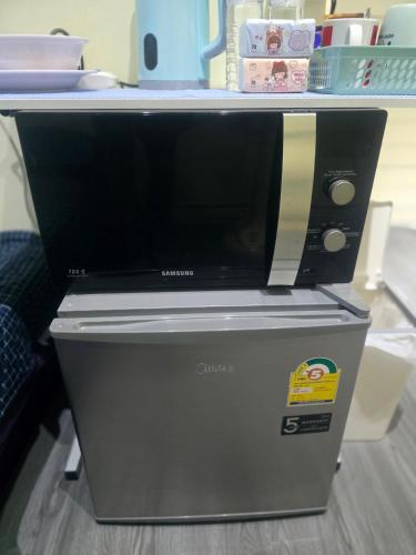 a computer monitor sitting on top of a table at 209 Cozy apartment with nice fan near skytrain & WiFi in Bangkok