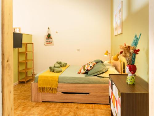 a bedroom with a bed in a room at Chirù-Guest House in Giba