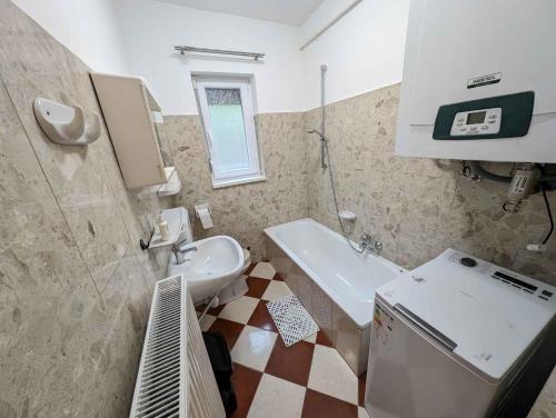 a small bathroom with a sink and a toilet at Holiday home in Balatonlelle 53637 in Balatonlelle