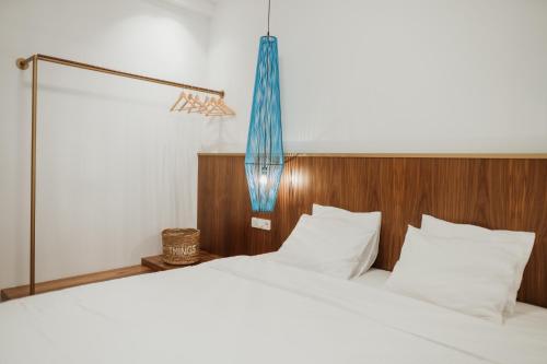 Postel nebo postele na pokoji v ubytování iKu Urban Apartment