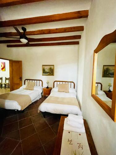 Postel nebo postele na pokoji v ubytování Casa El Higueral