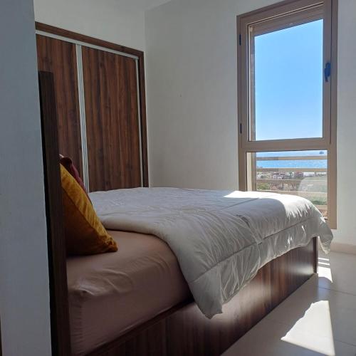 Una cama o camas en una habitación de Sea House AGADIR