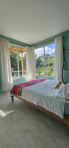 Кровать или кровати в номере Casa Li Tayrona