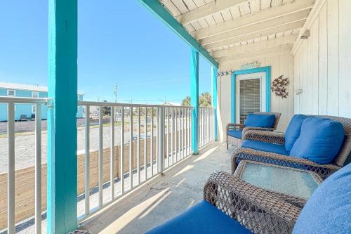 a balcony with two chairs and a view of the ocean at Sundial Unit D1 in Gulf Shores