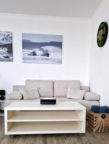 a living room with a couch and a table at Grand Apartman - 5 Star Luxury Podhajska Apartman in Podhájska