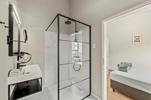 a bathroom with a shower and a sink at Kas di Rosa Curacao luxurious holiday home in Grote Berg
