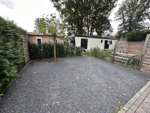 Κήπος έξω από το Bosrust & Bubbels - Chalet met hottub in putten