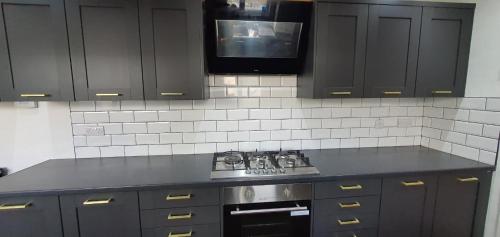 Η κουζίνα ή μικρή κουζίνα στο Spacious Room in Leicester