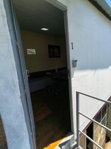 an open door to a room with a couch at Departamento 4 - 1er piso Centro Pileta in Formosa