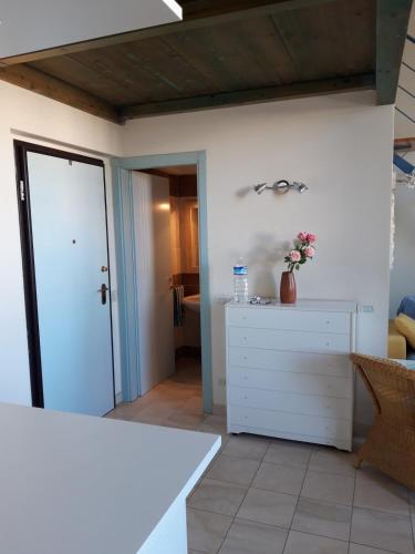 Ένα ή περισσότερα κρεβάτια σε δωμάτιο στο Residence sul mare all'interno del parco naturale con piscina