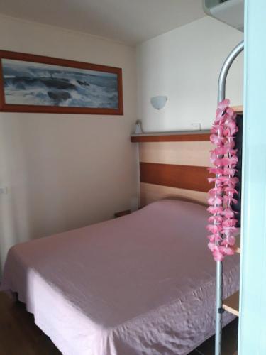 Ένα ή περισσότερα κρεβάτια σε δωμάτιο στο Residence sul mare all'interno del parco naturale con piscina