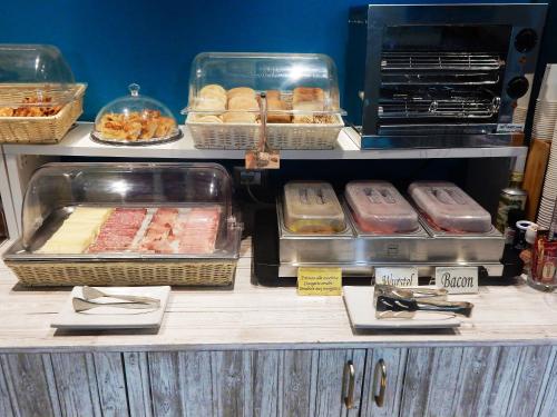 a buffet with different types of food on display at Hotel Kaly in Ventimiglia
